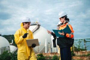 Engineers performing an environmental compliance assessment at an industrial facility.